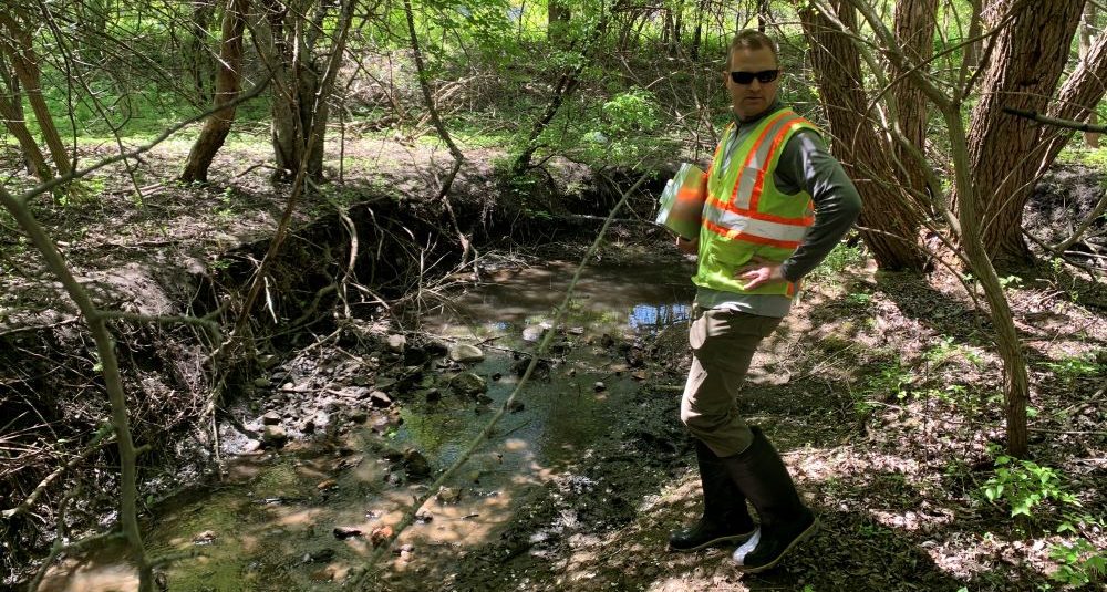 Restoration Ecologist Conducting Stream Assessment